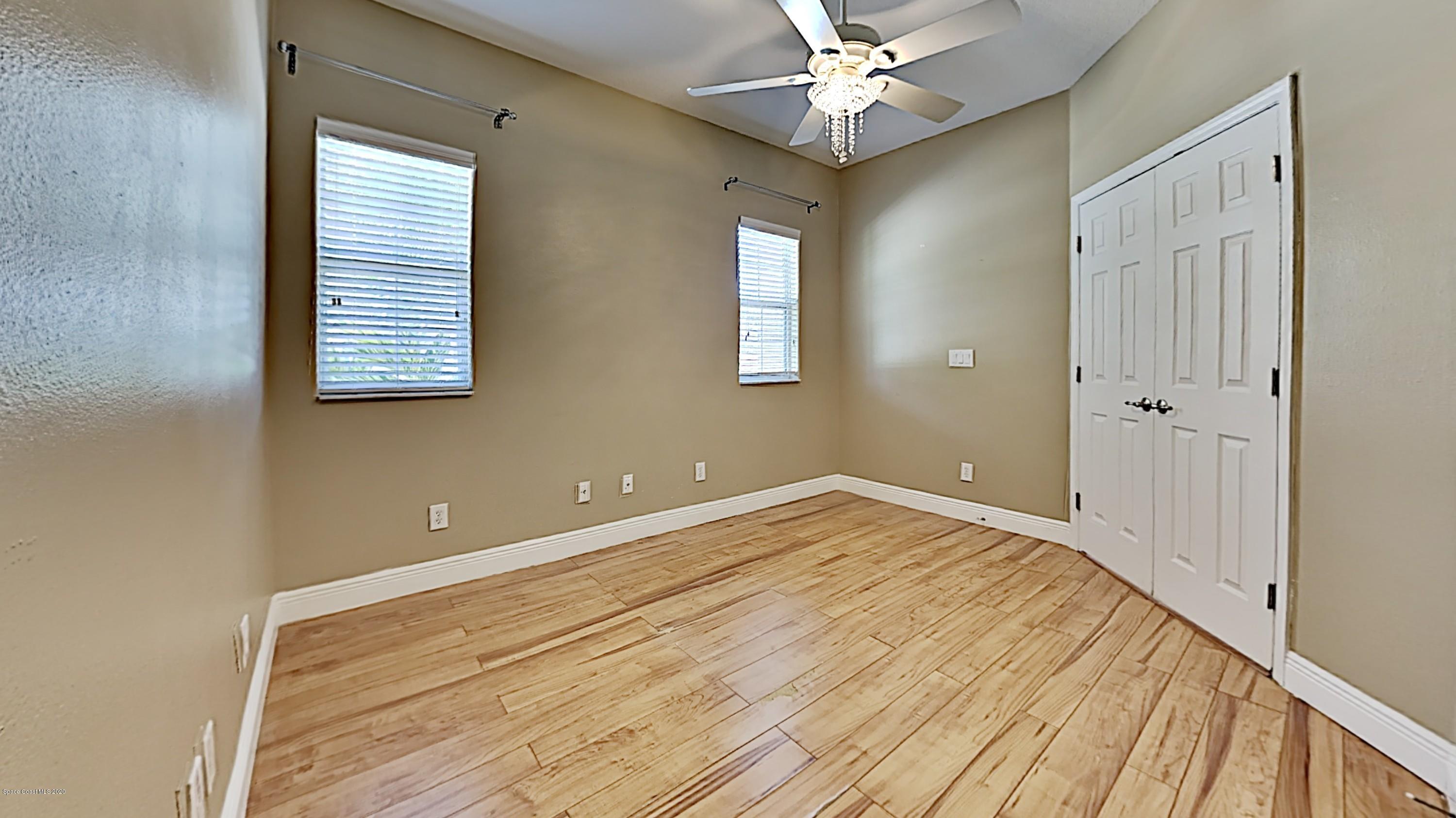 830 Riviera Drive Northeast Palm Bay, FL 32905 - Photo 19 of 21 a view of empty room with window