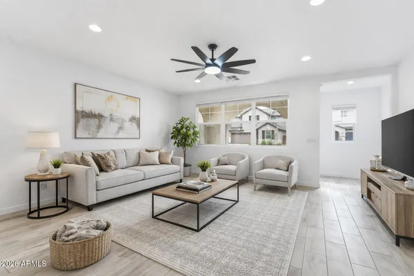 a view of empty room with wooden floor and windows