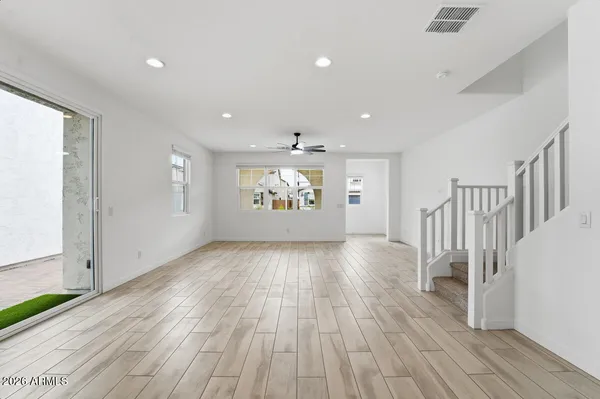 a view of a dining room with furniture and a kitchen