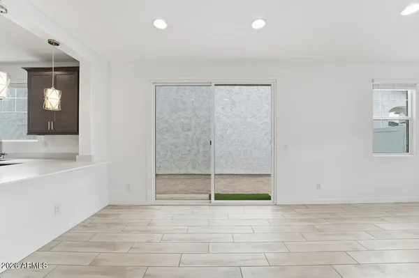 a kitchen with cabinets stainless steel appliances and sink
