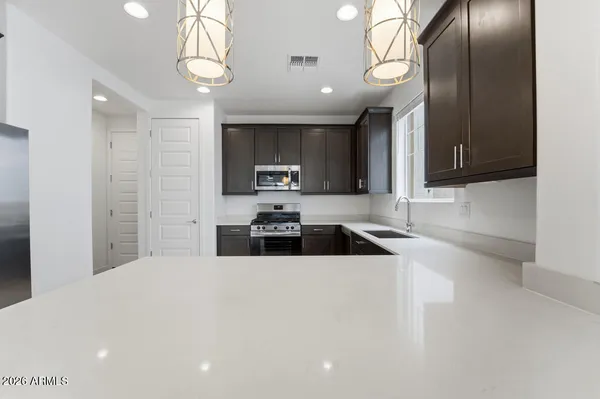 a kitchen with a stove and a microwave