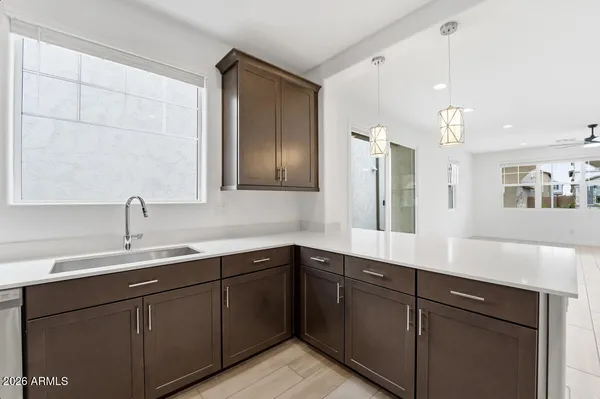 a spacious bedroom with a bed and a table