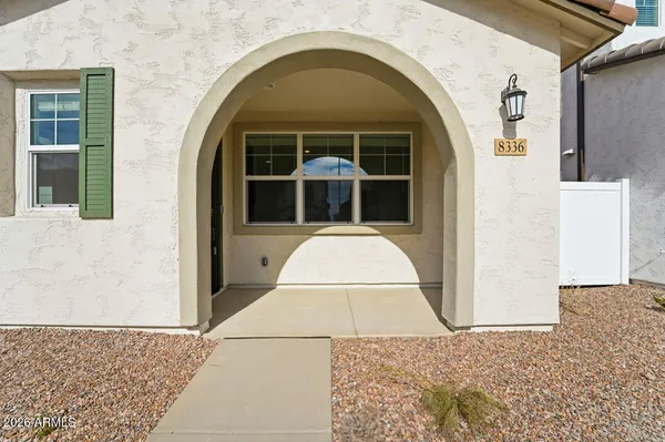 a view of a brick house with windows