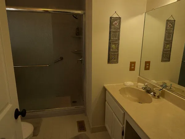 a bathroom with a sink and mirror