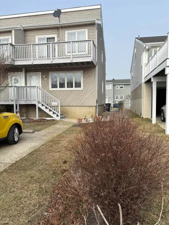 a view of a car park in front of house