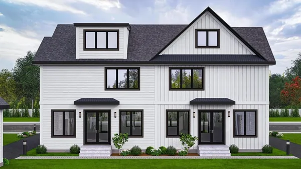 a front view of a house with a yard and potted plants
