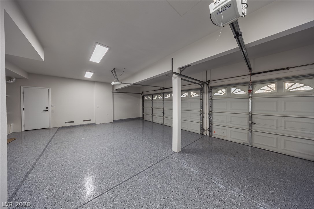 8800 Lusso Las Vegas, NV 89134 - Photo 83 of 85 Garage featuring a garage door opener