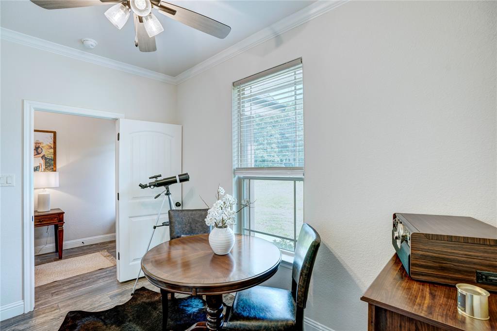 1355 Jay Bird Road Springtown, TX 76082 - Photo 9 of 40 a living room with furniture and a chandelier