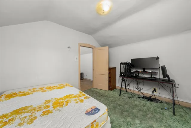 a bedroom with a bed and a table in it