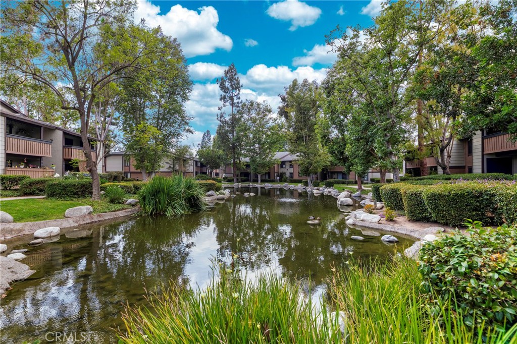 20702 El Toro Road, Unit 178 Lake Forest, CA 92630 - Photo 24 of 30 a view of a lake with houses