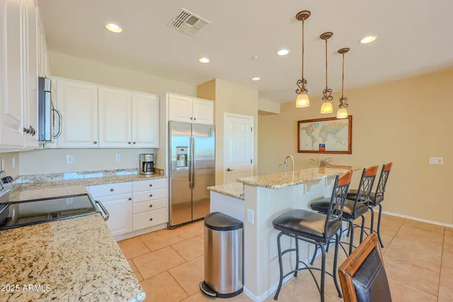 a large kitchen with lots of counter space and windows