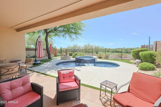 a view of swimming pool with outdoor seating and a couch
