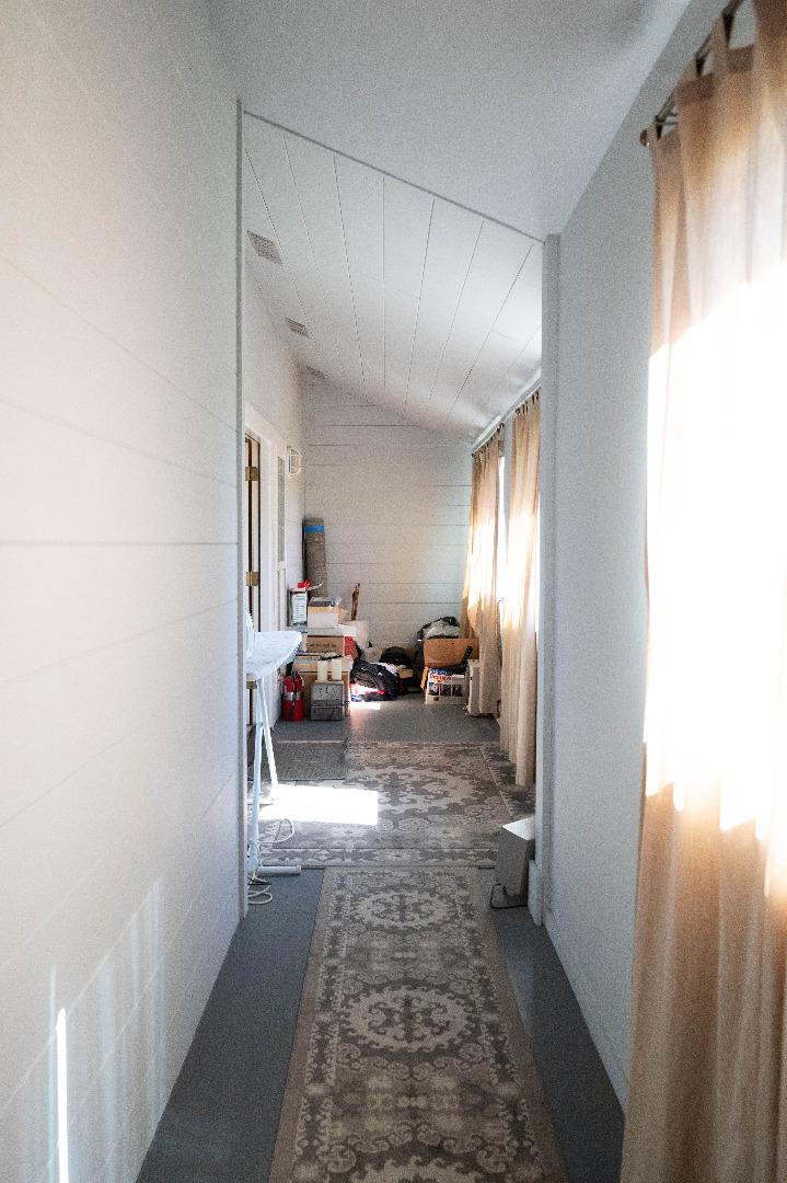1184 Inverness Avenue Santa Clara, CA 95050 - Photo 22 of 29 a view of a hallway with couch and a window