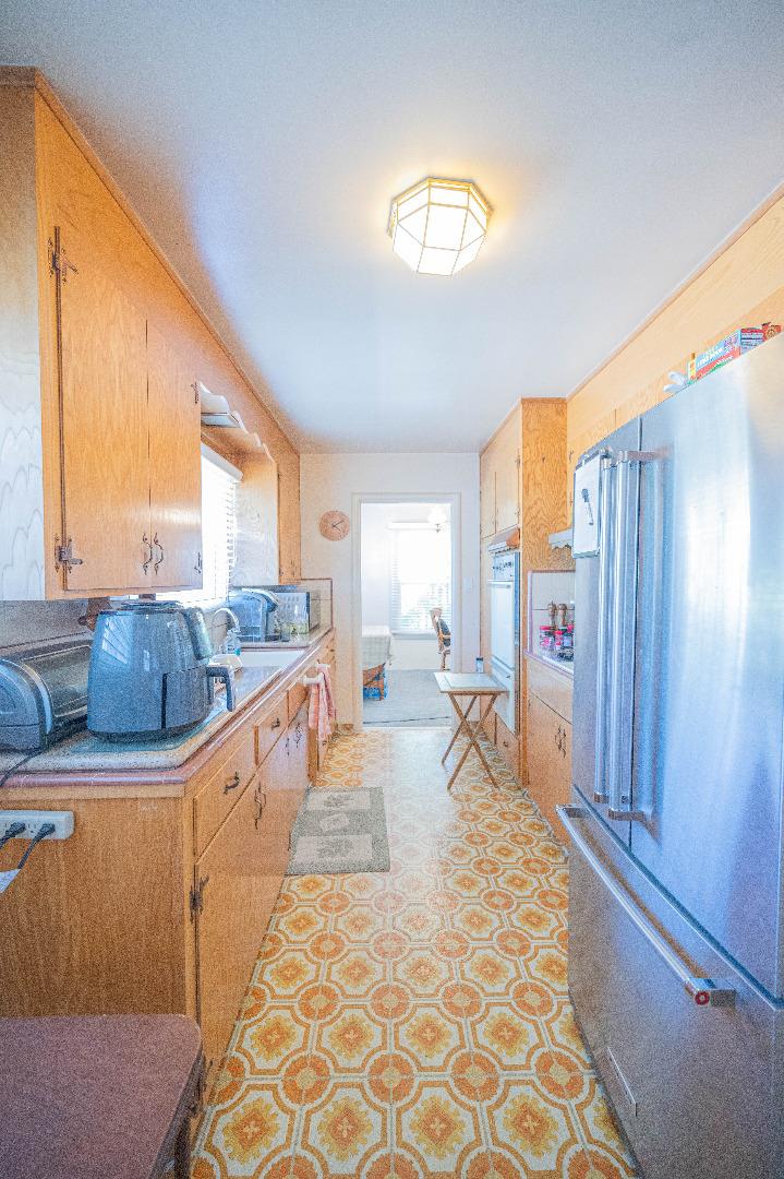 1184 Inverness Avenue Santa Clara, CA 95050 - Photo 10 of 29 a large living room with stainless steel appliances granite countertop furniture and a large window