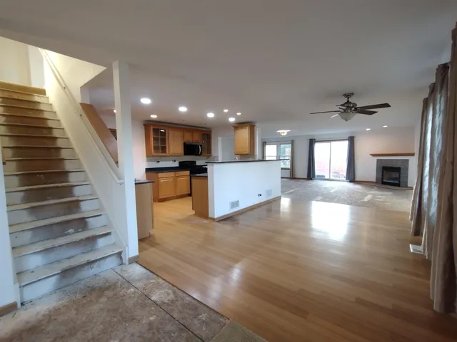 a view of kitchen with cabinets and wooden floor