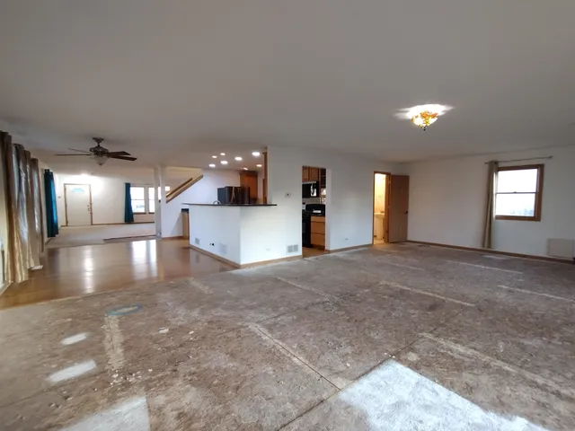a view of a kitchen with a sink and a chandelier