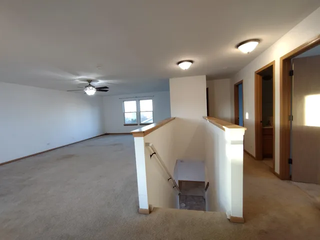 a view of livingroom with hardwood floor and staircase