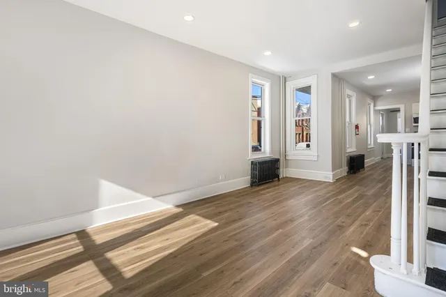a view of livingroom with hardwood floor and hallway