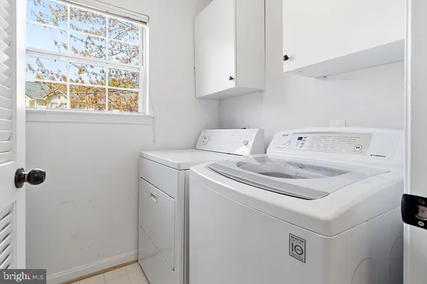 a view of a kitchen with a sink and a window