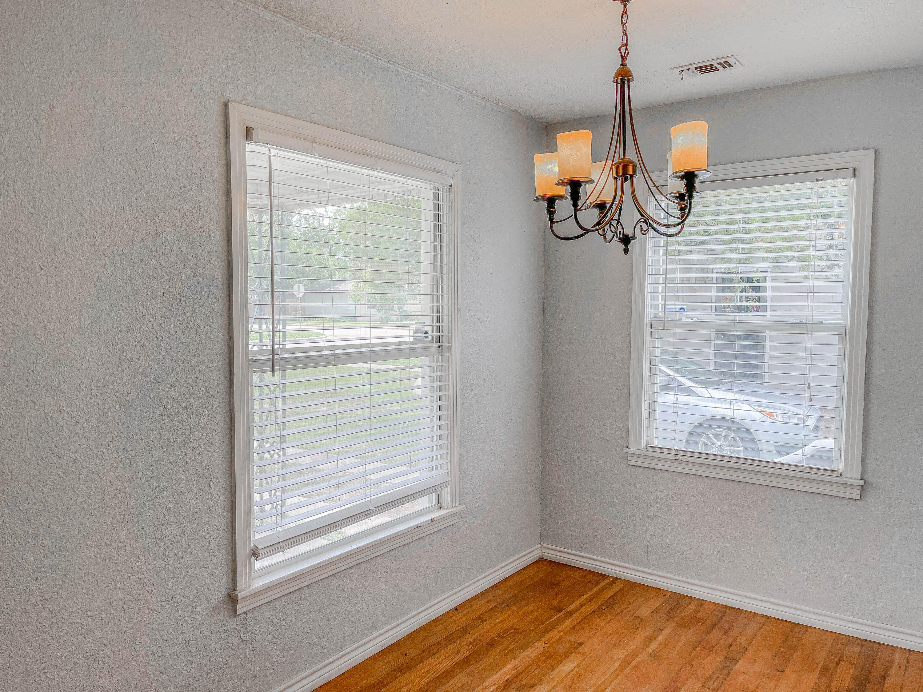 3418 26th Street Lubbock, TX 79410 - Photo 13 of 16 a view of a room with a window and wooden floor