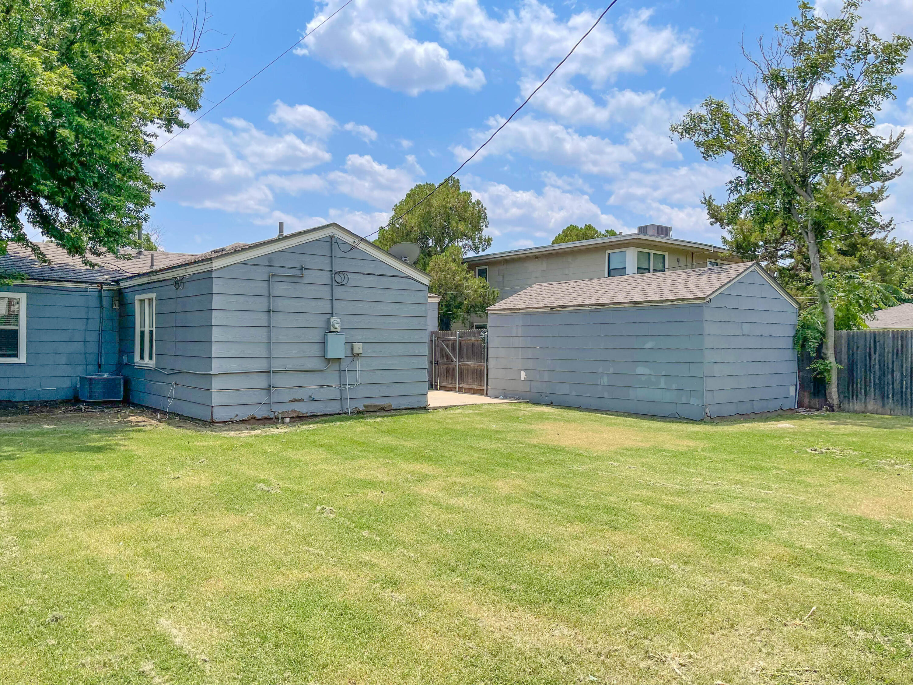 3418 26th Street Lubbock, TX 79410 - Photo 8 of 16 a view of a backyard of the house
