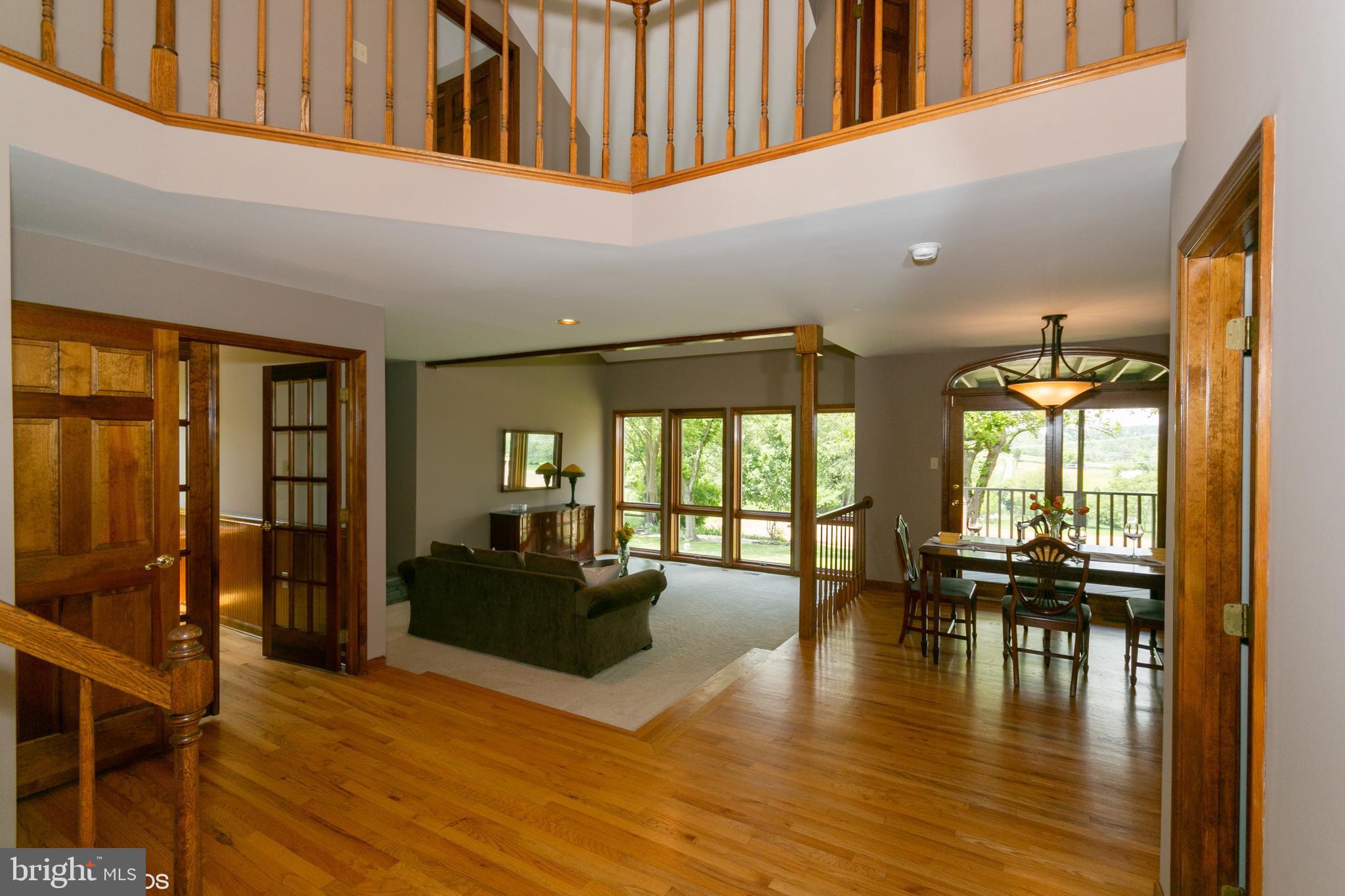7110 Masters Road New Market, MD 21774 - Photo 5 of 29 A 2 story foyer opening to living/dining room area