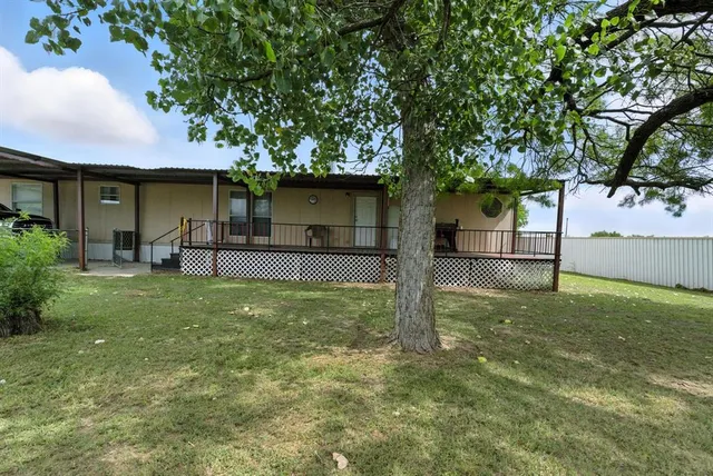 a view of a chairs in patio
