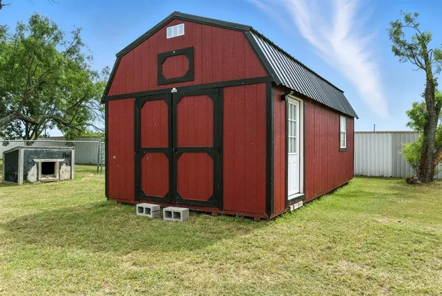 a view of a big yard with potted plants