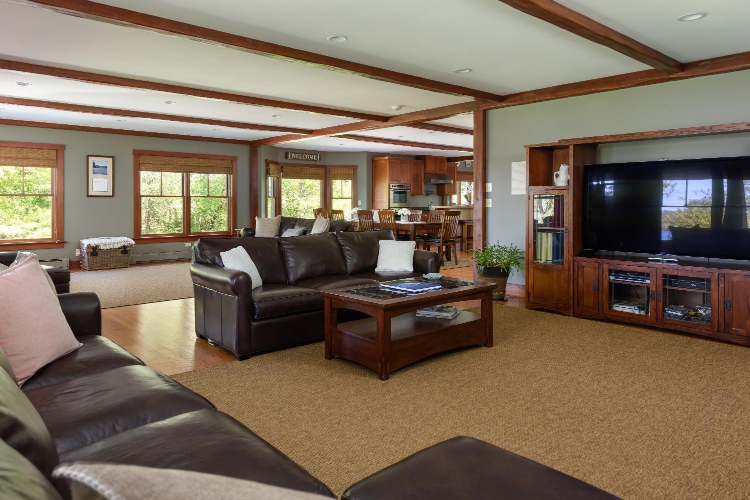 51 Sequattom Road Harwich, MA 02645 - Photo 35 of 35 a living room with furniture and a flat screen tv