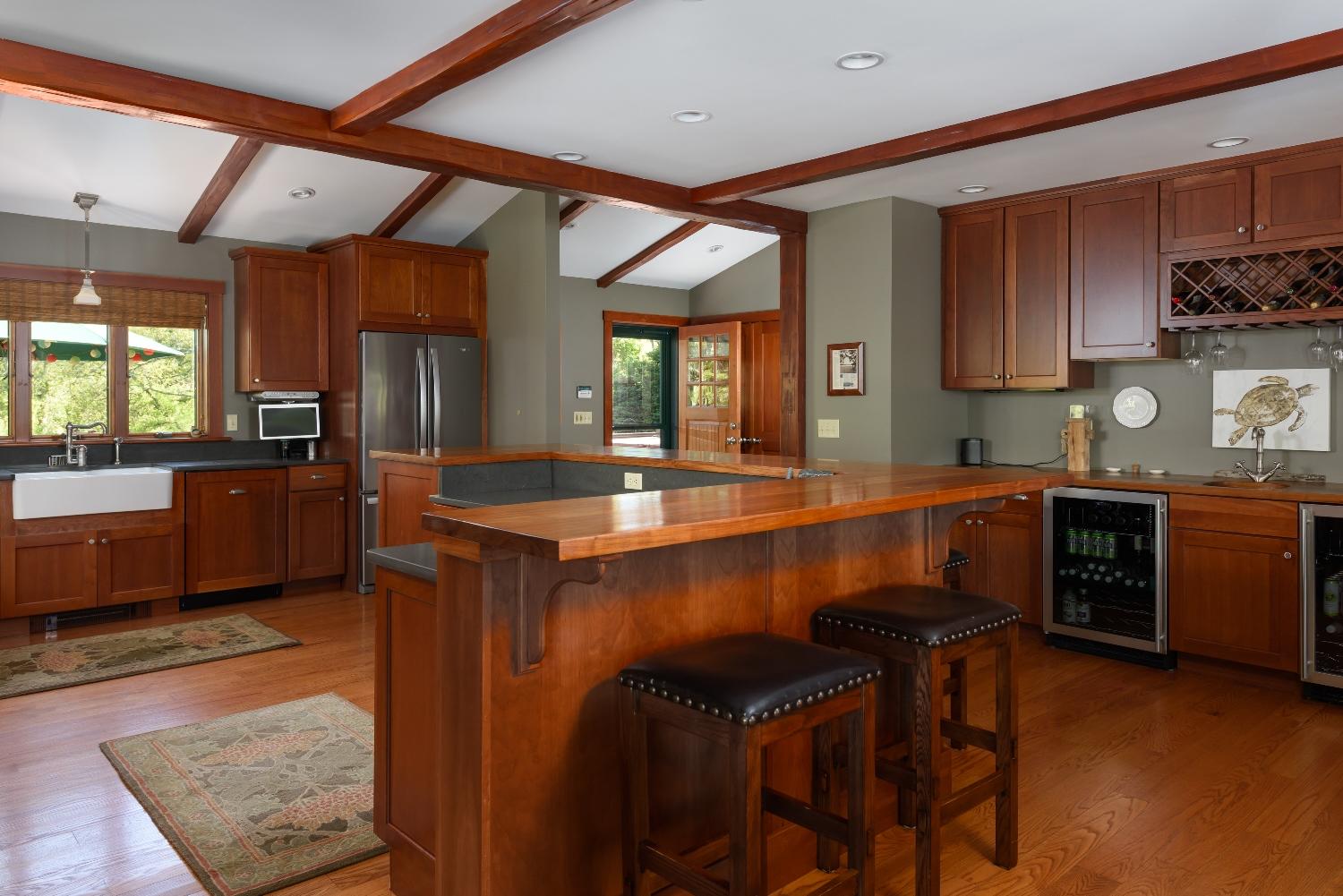 51 Sequattom Road Harwich, MA 02645 - Photo 16 of 35 a kitchen with a table chairs sink and cabinets