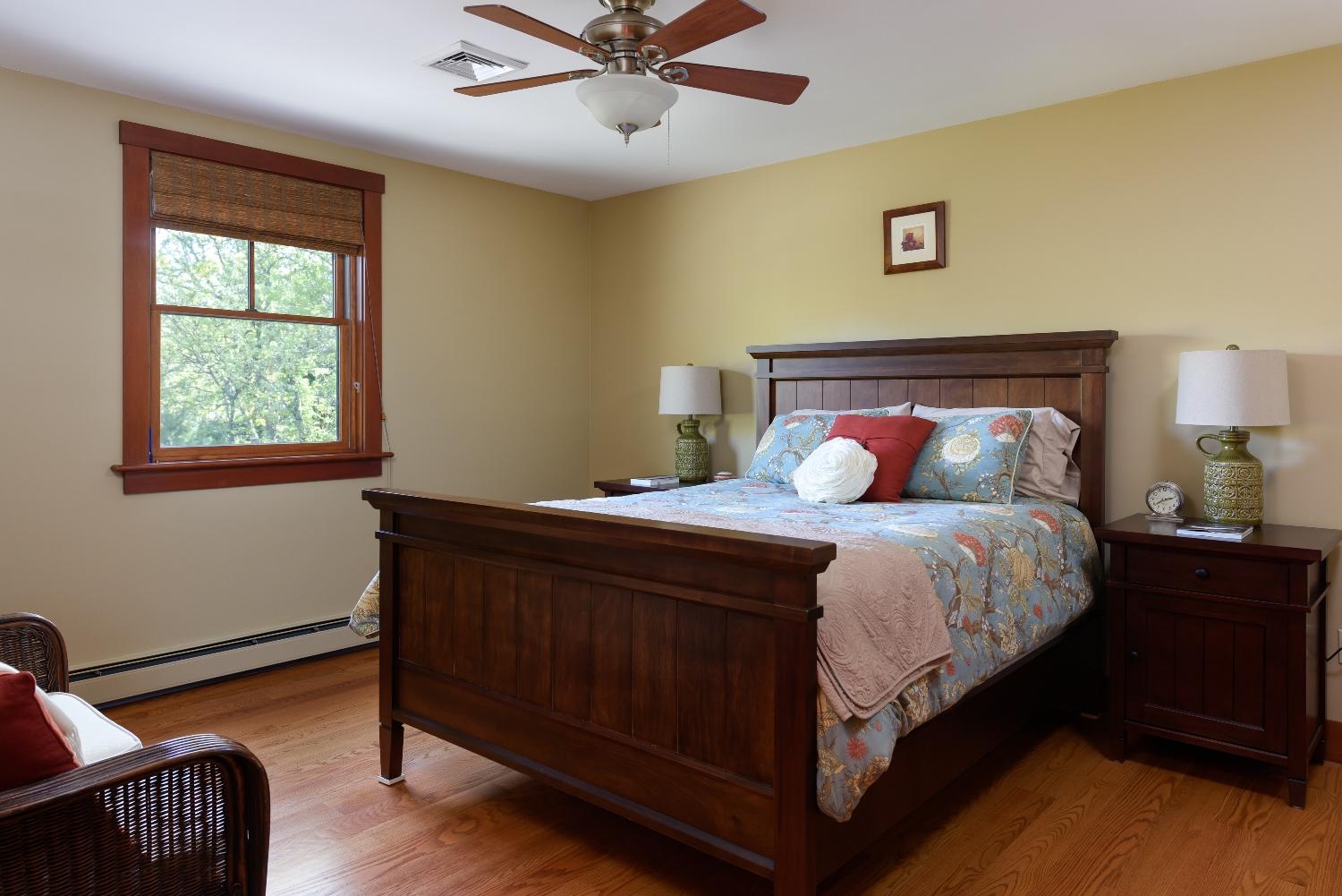 51 Sequattom Road Harwich, MA 02645 - Photo 19 of 35 a bedroom with a bed lamp and a window