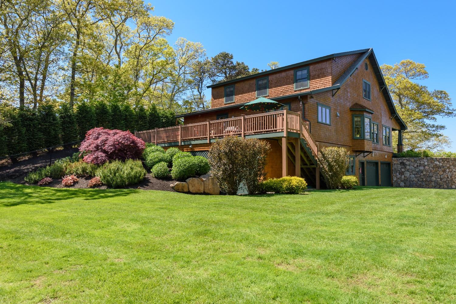 51 Sequattom Road Harwich, MA 02645 - Photo 27 of 35 a view of a house with a yard and plants