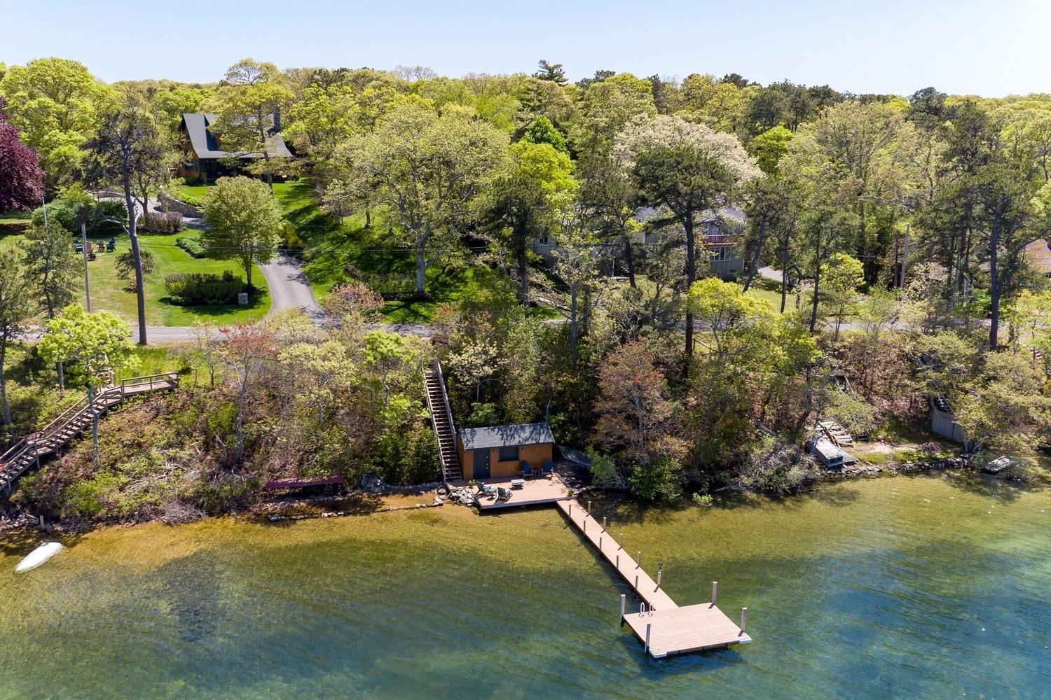 51 Sequattom Road Harwich, MA 02645 - Photo 6 of 35 a view of a swimming pool with a yard