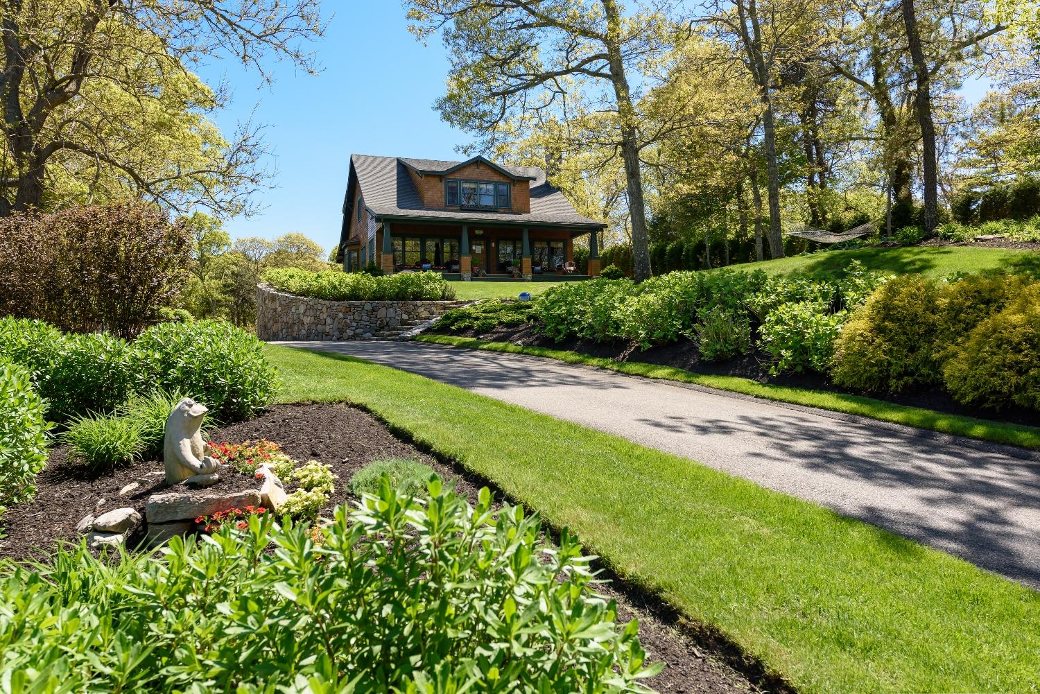 51 Sequattom Road Harwich, MA 02645 - Photo 7 of 35 a front view of a house with a yard and shrubs