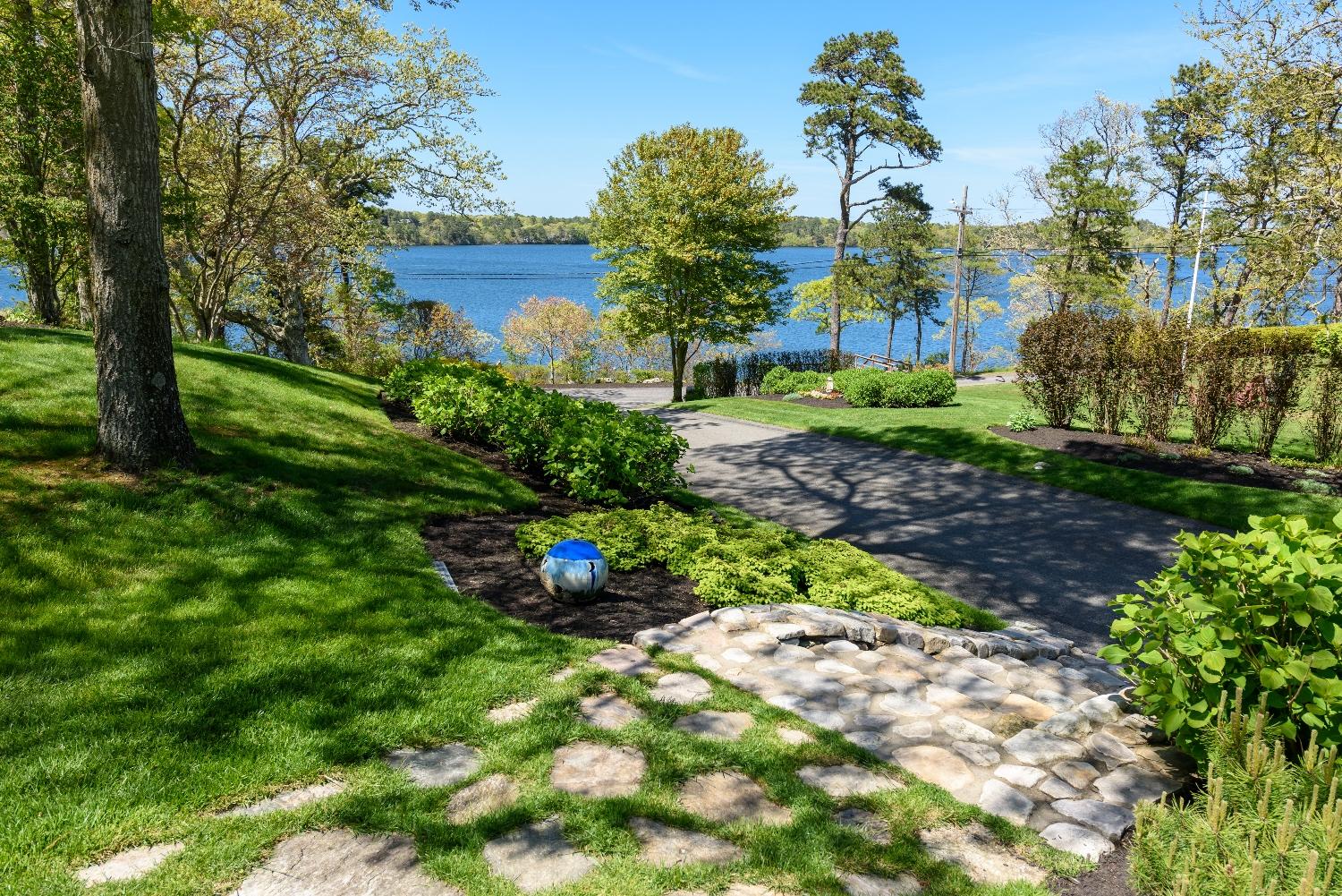 51 Sequattom Road Harwich, MA 02645 - Photo 10 of 35 a view of a garden with a fountain