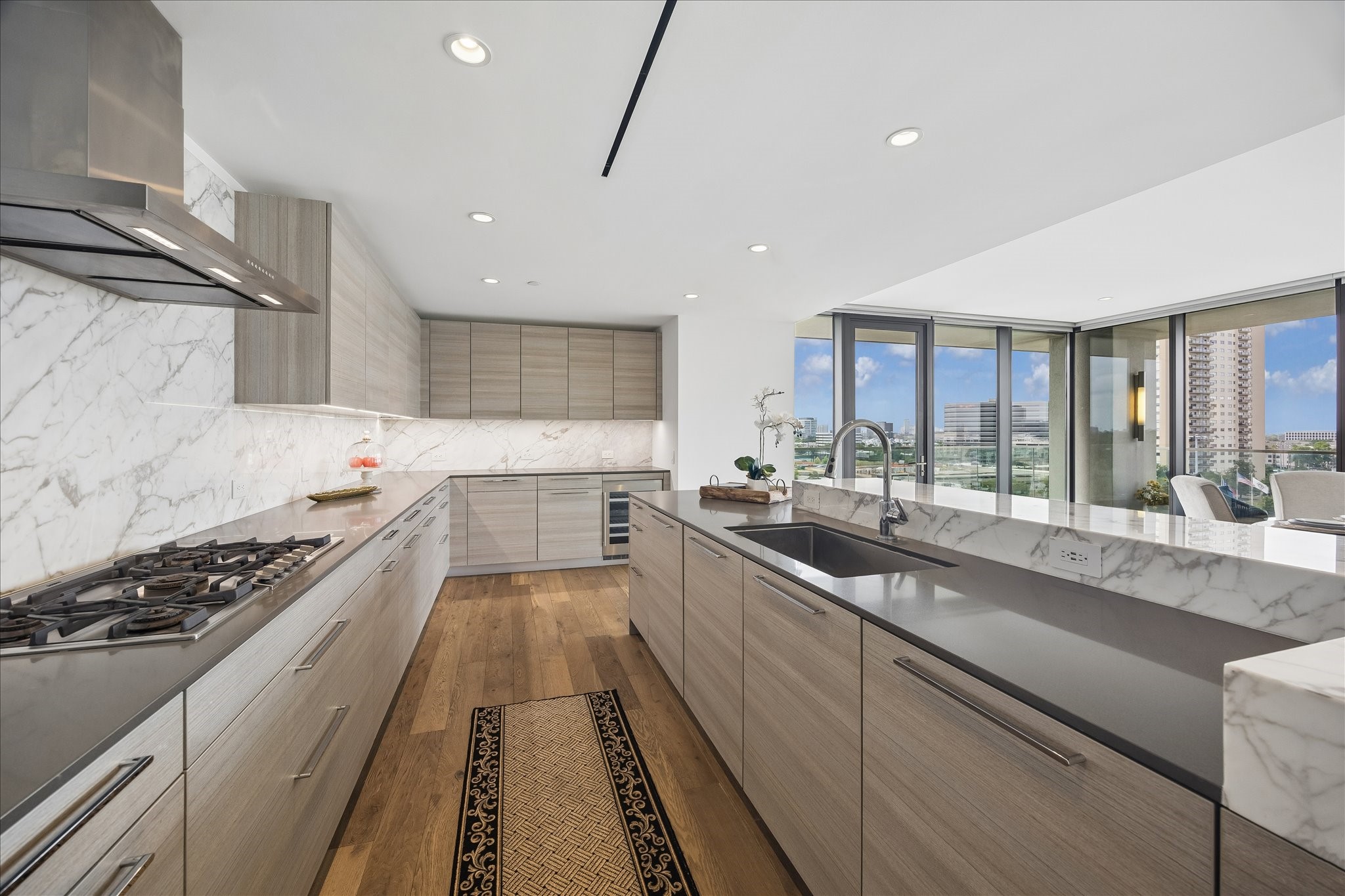 3433 Westheimer Road, Unit 702 Houston, TX 77027 - Photo 11 of 48 The chef's kitchen features designer Poggenpohl cabinetry integrating the appliances, and Calacatta marble back splash curated for the discerning culinary enthusiast.