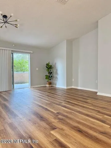 a large kitchen with kitchen island a stove a refrigerator a sink dishwasher with a dining table and chairs