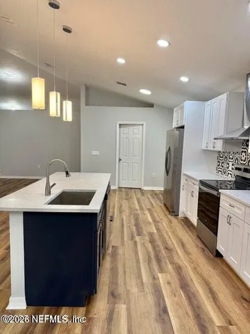 a view of an empty room with a window