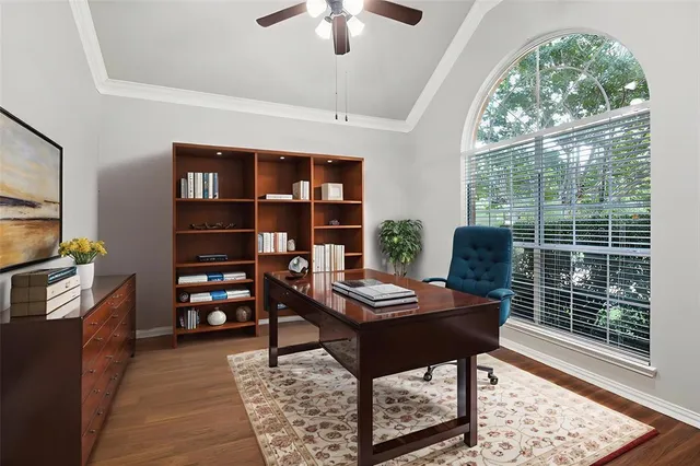 a reading room with furniture and a floor to ceiling window