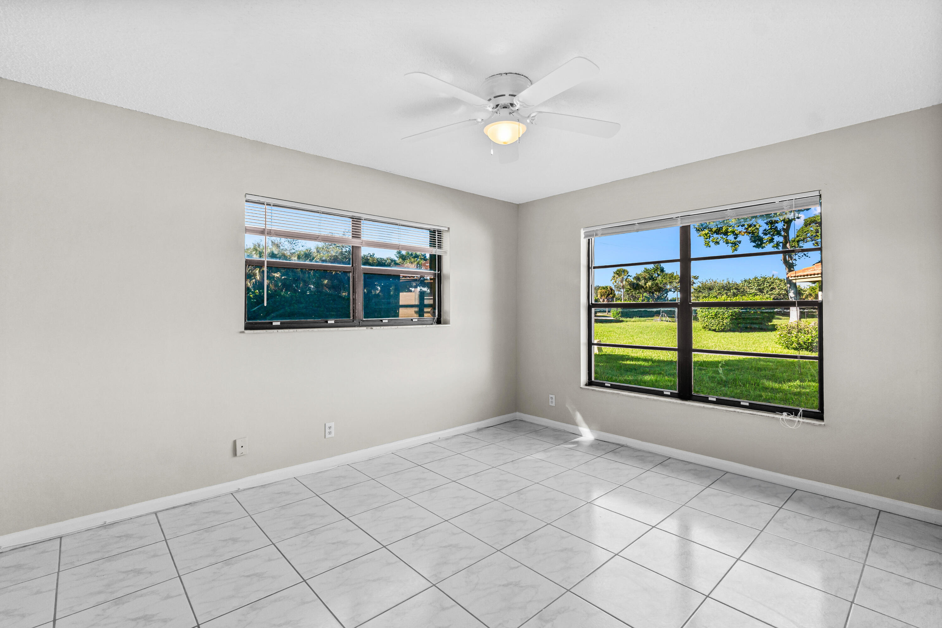 4640 Rosewood Tree Court, Unit B Boynton Beach, FL 33436 - Photo 21 of 27 a view of an empty room with a window