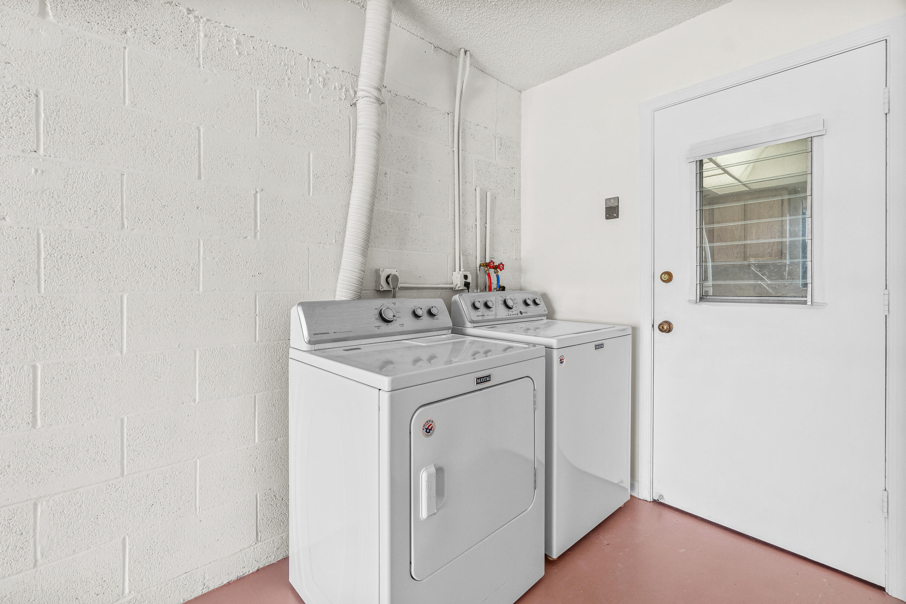 4640 Rosewood Tree Court, Unit B Boynton Beach, FL 33436 - Photo 25 of 27 a utility room with dryer and washer