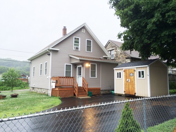 2 Burton Court Worcester, MA 01607 - Photo 1 of 25 a front view of a house with a garden