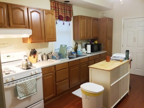 2 Burton Court Worcester, MA 01607 - Photo 11 of 25 a kitchen with a sink cabinets and wooden floor