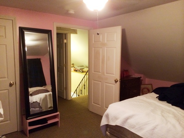 2 Burton Court Worcester, MA 01607 - Photo 18 of 25 a bedroom with a bed and wooden floor