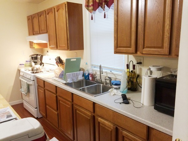 2 Burton Court Worcester, MA 01607 - Photo 10 of 25 a kitchen with sink a microwave and cabinets