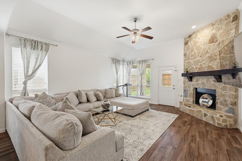 215 Equestrian Road Hickory Creek, TX 75065 - Photo 16 of 36 a living room with furniture and a fireplace