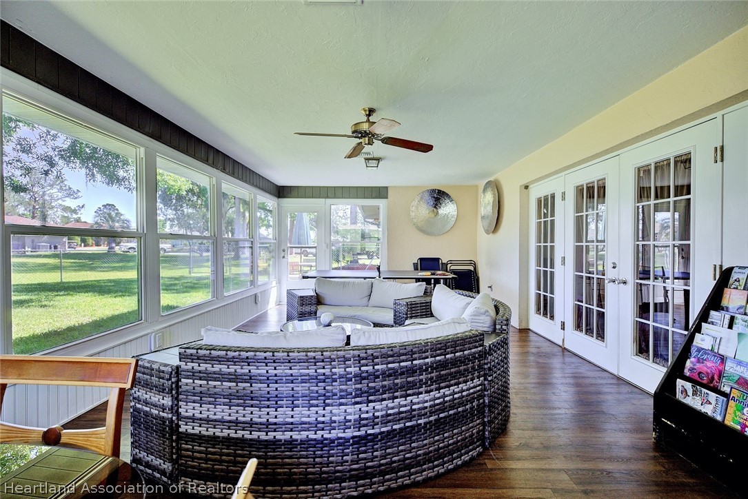 3601 Divot Road Sebring, FL 33872 - Photo 31 of 31 a living room with furniture and a floor to ceiling window