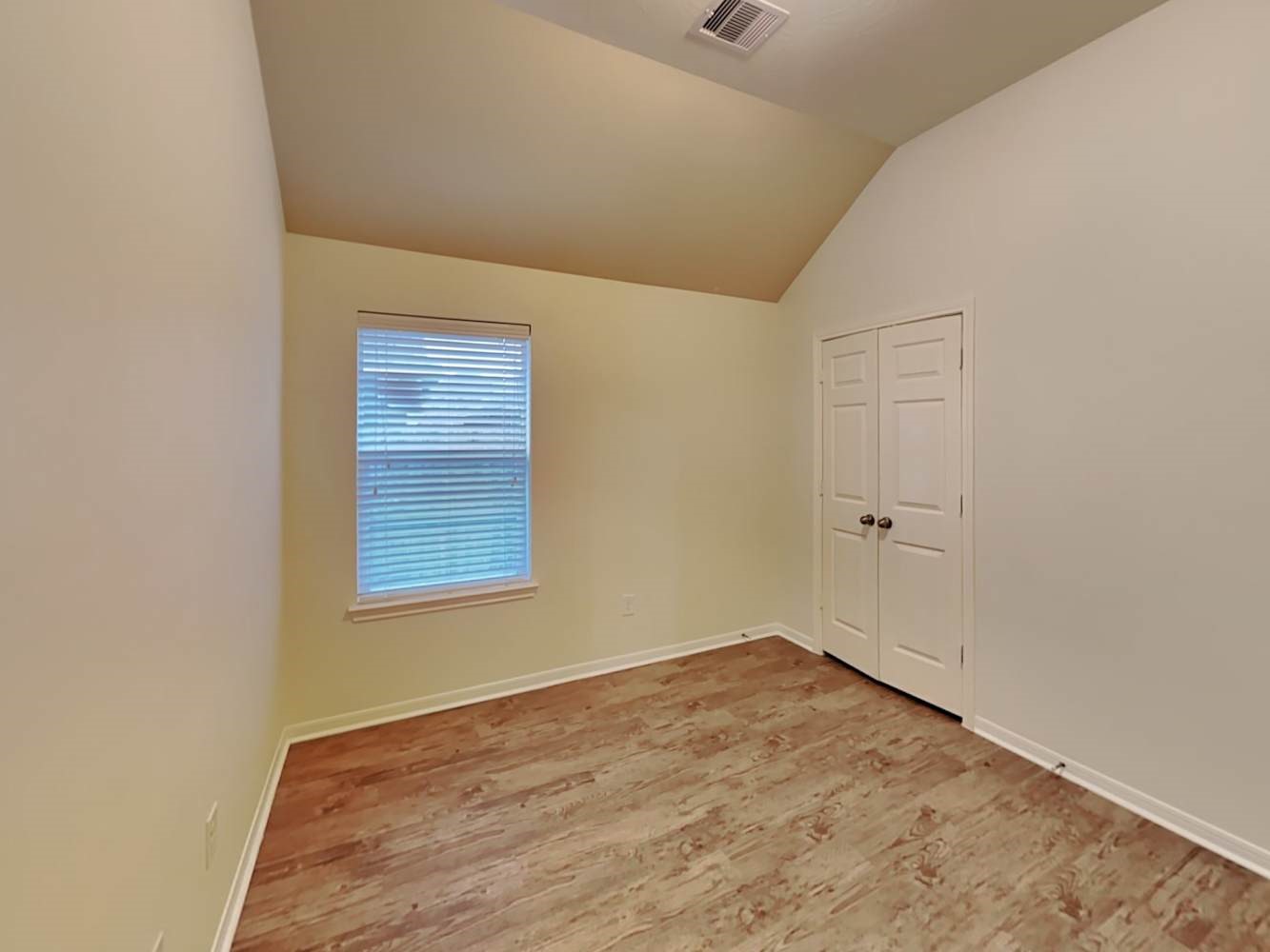 30619 Ginger Trace Drive Spring, TX 77386 - Photo 12 of 16 a view of an empty room with wooden floor and a window