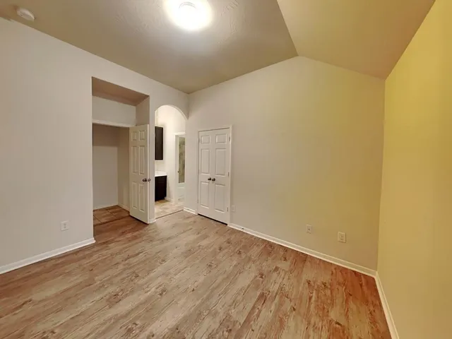 a bathroom with a sink mirror and toilet