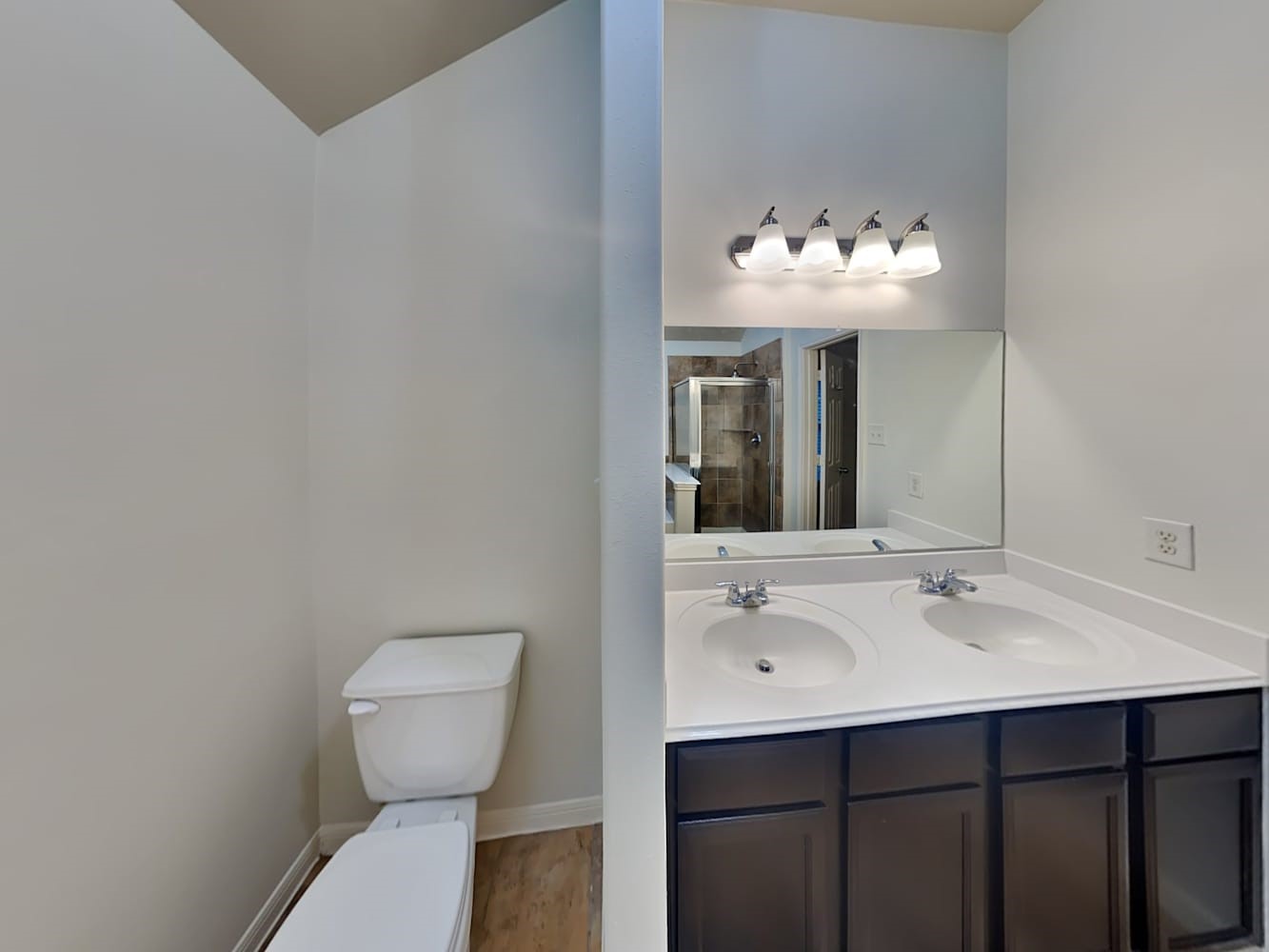 30619 Ginger Trace Drive Spring, TX 77386 - Photo 14 of 16 a bathroom with a sink mirror and toilet